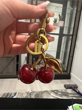 Coach Gold-Tone Cherry Keychain Charm in Shimmering Red